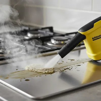 Karcher SC 4 EasyFix cleaning a greasy kitchen hob with steam.