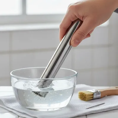 User descaling a steam cleaner nozzle to fix a leak caused by mineral buildup.