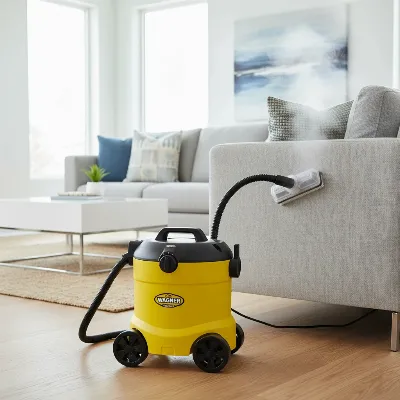 Wagner 925E SteamMachine Elite portable steamer with upholstery attachment cleaning a sofa.